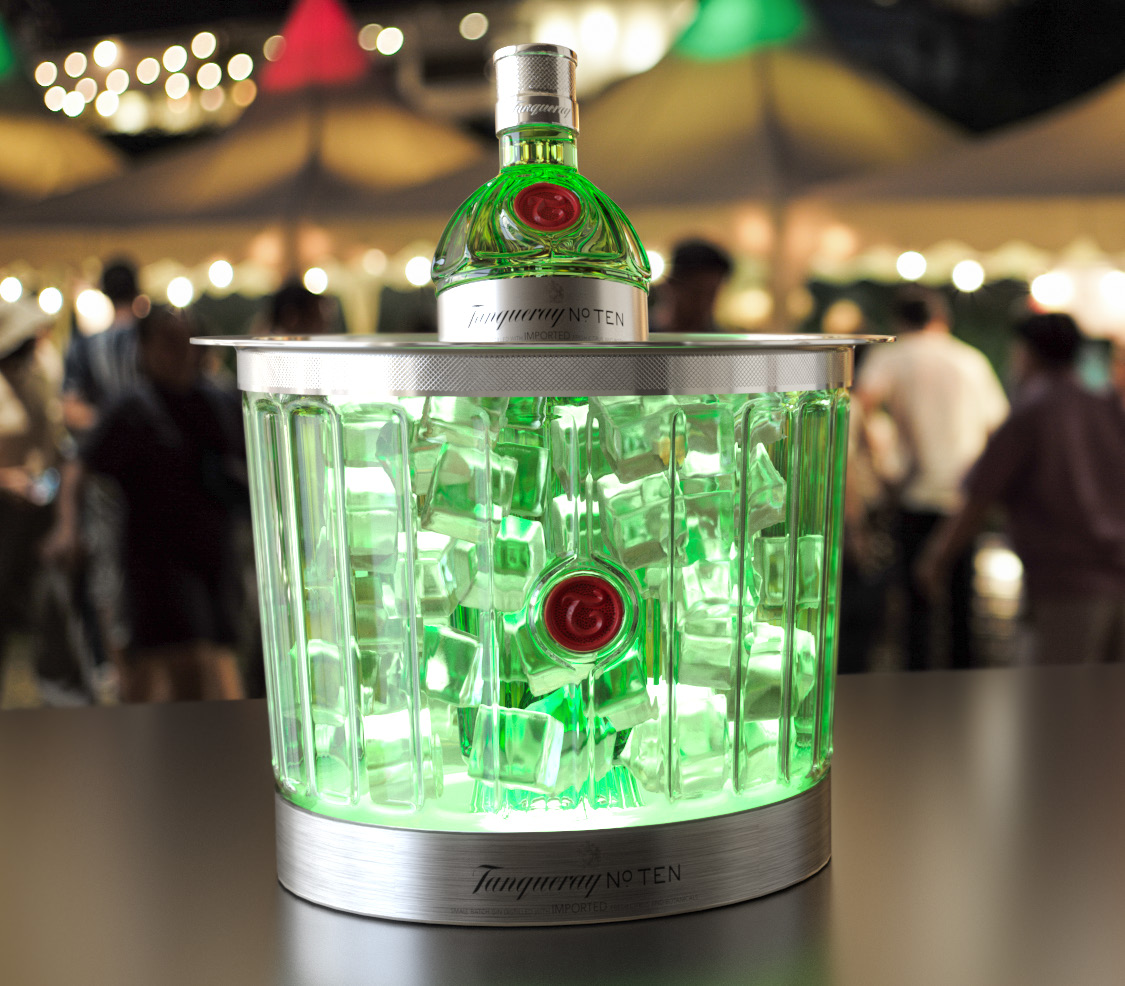 Tanqueray no. 10 beverage bottle inside an illuminated ice bucket 