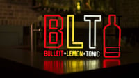 BLT LED neon sign on a bar counter