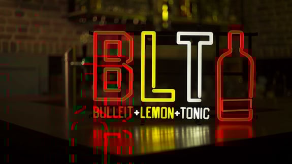 BLT LED neon sign on a bar counter