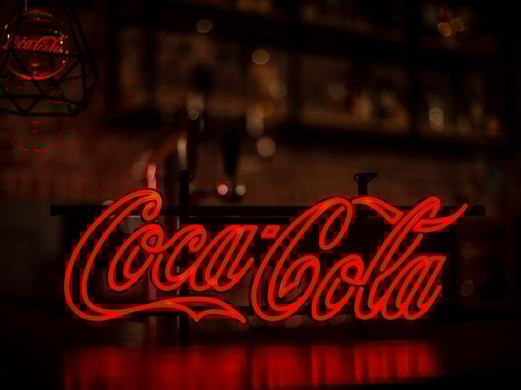 Coca Cola Illuminated LED neon sign on bat counter