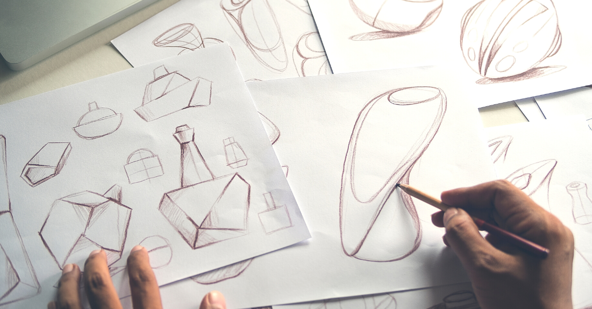 design portfolio with designer drawing more designs 